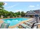 This community pool offers a refreshing escape with clear water, sun loungers, and a nearby bathhouse at 326 Hope Valley Rd, Knightdale, NC 27545