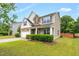 Two-story home with front lawn and landscaping at 326 Hope Valley Rd, Knightdale, NC 27545