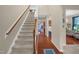 Inviting home foyer featuring a staircase with carpeted steps and hardwood floors at 326 Hope Valley Rd, Knightdale, NC 27545