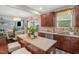 Warm kitchen featuring stainless steel appliances and an island with a view into the living room at 326 Hope Valley Rd, Knightdale, NC 27545
