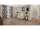 Comfortable living room featuring modern curtains, contemporary decor, and sleek wood flooring at 326 Hope Valley Rd, Knightdale, NC 27545