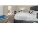Well-lit bedroom features neutral walls and a king-size bed with an en suite bathroom at 326 Hope Valley Rd, Knightdale, NC 27545