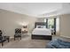 Well-lit bedroom features neutral walls, a tray ceiling, and a large window for natural light at 326 Hope Valley Rd, Knightdale, NC 27545