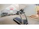 Finished basement workout area with exercise equipment, natural light, and high ceilings at 3324 Thomas Rd, Raleigh, NC 27607