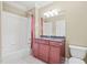 Well maintained bathroom with tub/shower combo and granite-topped vanity at 3324 Thomas Rd, Raleigh, NC 27607
