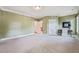 Spacious bedroom offering plush carpet, white trim, and access to other rooms and bath at 3324 Thomas Rd, Raleigh, NC 27607
