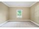 Bright bedroom with neutral walls, white trim, carpeting and a natural view through the window at 3324 Thomas Rd, Raleigh, NC 27607