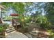 Enjoy outdoor living on this beautiful deck with stone pathway and mature trees at 3324 Thomas Rd, Raleigh, NC 27607
