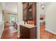Dining room features hardwood floors, glass front cabinetry with granite countertop at 3324 Thomas Rd, Raleigh, NC 27607