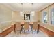 Inviting dining room featuring hardwood floors, stylish lighting, and neutral decor at 3324 Thomas Rd, Raleigh, NC 27607