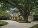 A stunning home with a well-manicured lawn, mature trees, and a circular driveway, creating a grand and inviting entrance at 3324 Thomas Rd, Raleigh, NC 27607