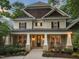 Charming front porch featuring rocking chairs, classic columns, and a welcoming entryway at 3324 Thomas Rd, Raleigh, NC 27607