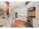 Kitchen features stainless steel appliances, gas cooktop, tile backsplash, and granite countertops at 3324 Thomas Rd, Raleigh, NC 27607
