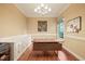 Office featuring hardwood floors, built-in cabinets, modern desk, and natural light at 3324 Thomas Rd, Raleigh, NC 27607