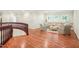 An upstairs sitting room with hardwood floors provides a view to the rear garden at 3324 Thomas Rd, Raleigh, NC 27607