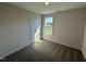 Cozy bedroom with neutral carpet, a window view, and ample natural light at 37 Chloe Ct, Selma, NC 27576