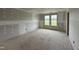 Unfinished bedroom with a large window offering natural light; ready for personal touches at 37 Chloe Ct, Selma, NC 27576