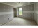 Unfinished bedroom featuring natural light and a closet, ready for your personalization at 37 Chloe Ct, Selma, NC 27576