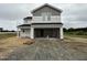 New two-story home featuring a two-car garage, neutral siding, and a classic architectural style at 37 Chloe Ct, Selma, NC 27576