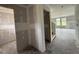 Unfinished living room with ample natural light from large windows; ready for customization at 37 Chloe Ct, Selma, NC 27576