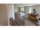 Open concept living area offering neutral walls, luxury vinyl plank flooring, and natural light at 37 Chloe Ct, Selma, NC 27576