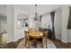 Charming dining room with natural lighting, wooden table, and an open view to the kitchen at 4413 Sugarbend Way, Raleigh, NC 27606