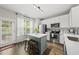 Bright kitchen with a central island, stainless steel appliances, and direct access to the outdoors at 4413 Sugarbend Way, Raleigh, NC 27606