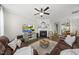 Spacious living room with fireplace, modern decor, and open access to the dining area at 4413 Sugarbend Way, Raleigh, NC 27606