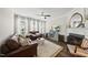 Inviting living room featuring a fireplace, stylish decor, and large windows for ample natural light at 4413 Sugarbend Way, Raleigh, NC 27606