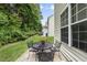 Cozy patio with a black metal table set, perfect for outdoor relaxation and enjoying the serene green space at 4413 Sugarbend Way, Raleigh, NC 27606