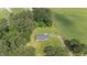 Overhead shot of brick house with large yard, greenery and farmland at 445 Lee County Line Rd, Broadway, NC 27505