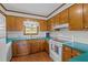 Classic kitchen with wood cabinets, and ample counter space, ready for updates at 445 Lee County Line Rd, Broadway, NC 27505