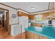 Functional kitchen with wood cabinets, and a cozy breakfast nook at 445 Lee County Line Rd, Broadway, NC 27505