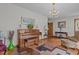 Spacious living room featuring a piano and comfortable seating arrangement at 445 Lee County Line Rd, Broadway, NC 27505