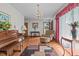 Bright and airy living room with large windows and comfortable seating area at 445 Lee County Line Rd, Broadway, NC 27505