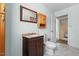 A cozy bathroom featuring tiled floors, a stylish vanity, and ample storage space at 4709 Tyne Dr, Durham, NC 27703