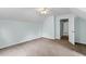 Spacious bedroom featuring plush carpeting and multiple windows for natural light at 4709 Tyne Dr, Durham, NC 27703
