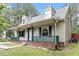 Charming home featuring a cozy front porch and dormer windows at 4709 Tyne Dr, Durham, NC 27703