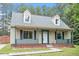 Charming home featuring a cozy front porch and dormer windows at 4709 Tyne Dr, Durham, NC 27703