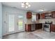 Updated kitchen featuring stainless steel appliances and granite countertops with backyard access at 4709 Tyne Dr, Durham, NC 27703