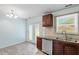 Bright kitchen with modern appliances, granite countertops, and a view of the backyard at 4709 Tyne Dr, Durham, NC 27703