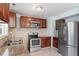 Bright kitchen with stainless steel appliances, granite countertops and abundant cabinet space at 4709 Tyne Dr, Durham, NC 27703
