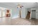 Open concept floorplan featuring wood-look flooring and stairs that lead to the upper level at 4709 Tyne Dr, Durham, NC 27703