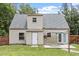 View of the home's rear exterior featuring a door to the backyard patio at 4709 Tyne Dr, Durham, NC 27703