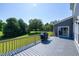 View from back deck shows a grill, a lush lawn and trees, providing a pleasant outdoor setting at 5013 Wheatridge Dr, Fuquay Varina, NC 27526