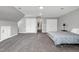 Huge bedroom with two beds, windows, neutral carpet and several closet doors at 5013 Wheatridge Dr, Fuquay Varina, NC 27526