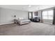 Expansive bedroom featuring two beds, soft grey walls and plush carpeting at 5013 Wheatridge Dr, Fuquay Varina, NC 27526