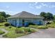 Exterior view of the community clubhouse with landscaped surroundings and ample parking at 5013 Wheatridge Dr, Fuquay Varina, NC 27526