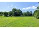 A vast green field enclosed by wooden fences, perfect for agricultural use or recreation at 5013 Wheatridge Dr, Fuquay Varina, NC 27526