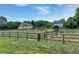 Spacious horse pasture with wooden fencing, offering ample space for horses to graze at 5013 Wheatridge Dr, Fuquay Varina, NC 27526
